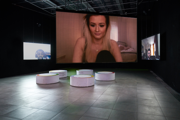 In Real Life, Liz Magic Laser, 2019, 5-channel HD video installation, 90 minutes; custom seating (dimensions variable). Commissioned by FACT, Liverpool, UK. Photo: Rob Battersby.